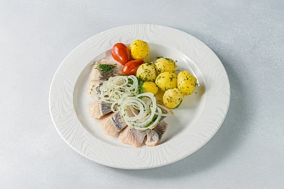 Herring fillet with boiled potatoes and fresh herbs